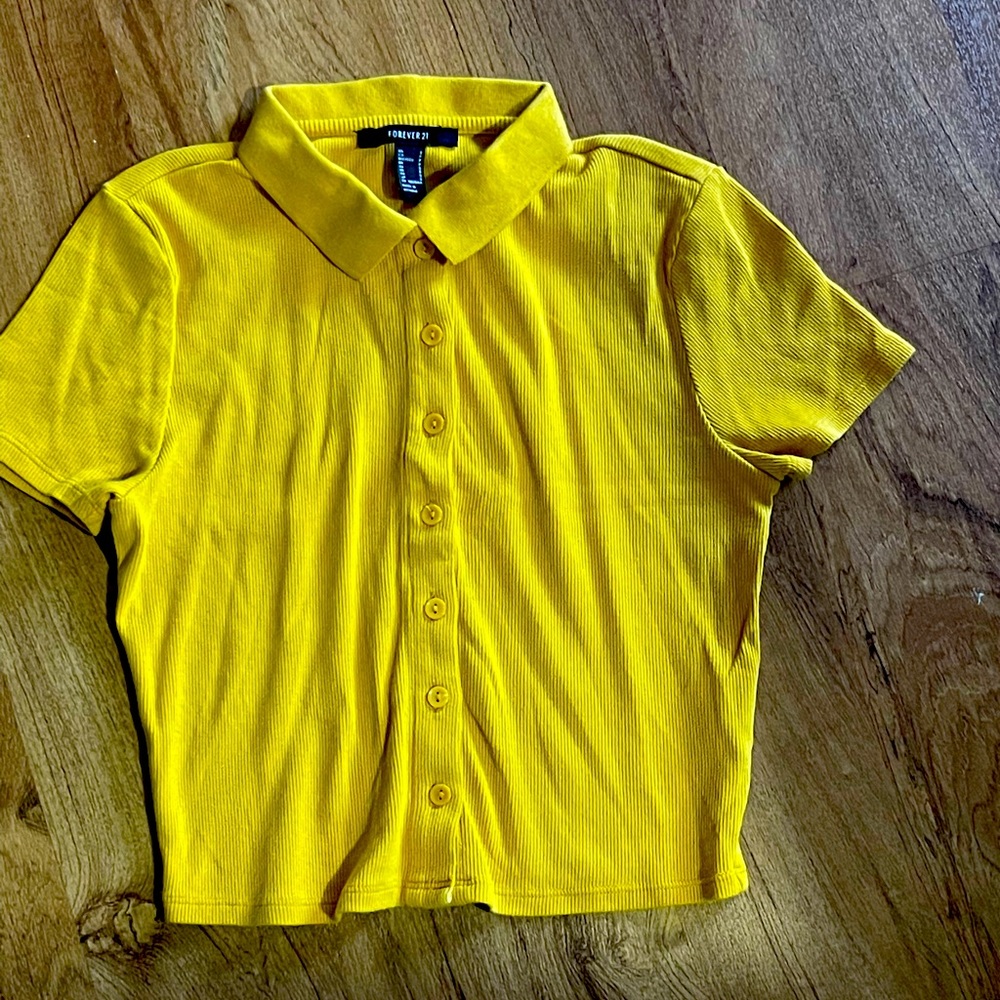 Forever21 button down shirt. Can be worn as a crop top if you size down.